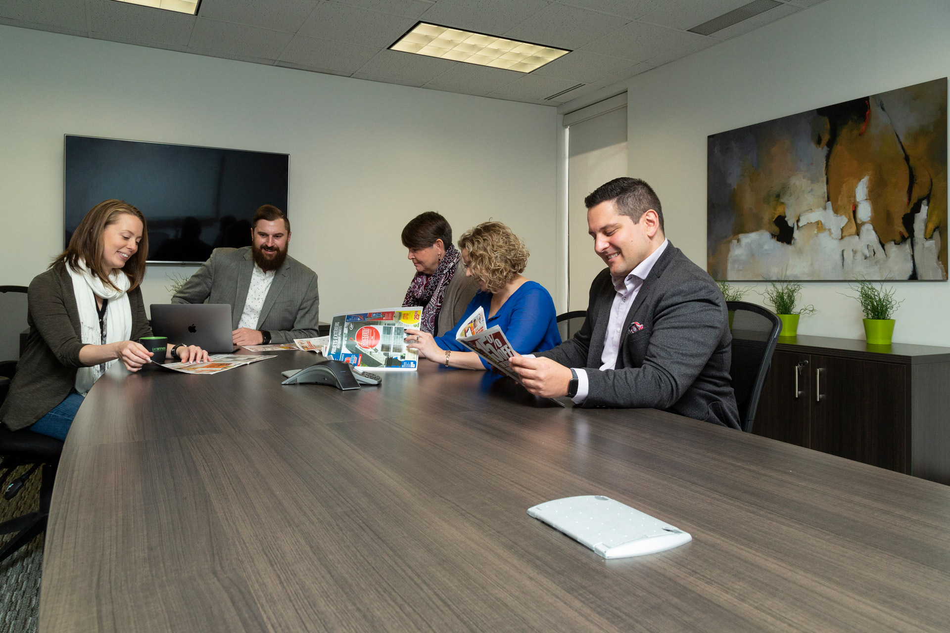 Staff discussing strategy in our boardroom