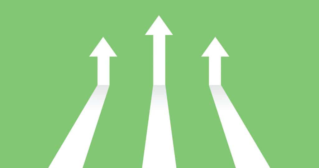Vector illustration image of white arrows on green background coming in and pointing up to depict increasing trends. Specifically, indicating the topic of the blog post which is digital trends in 2023.